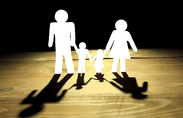 Paper family with black shadows