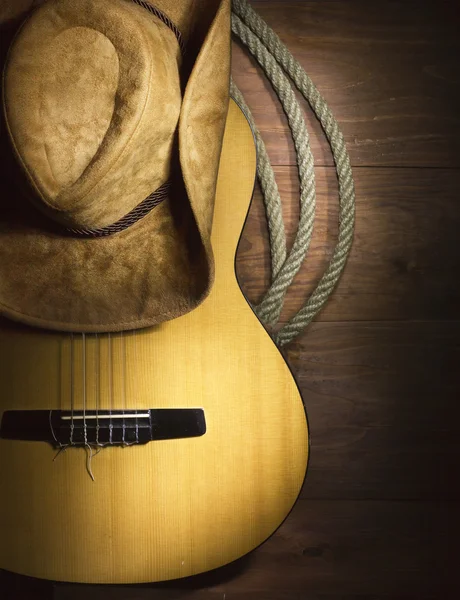 Country music with guitar on wood background