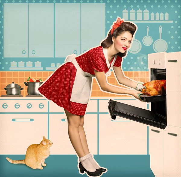 Young attractive housewife cooking in an oven.Retro kitchen room