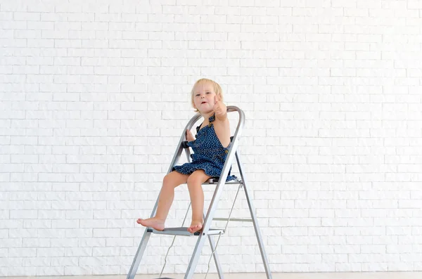 Little girl at ladder