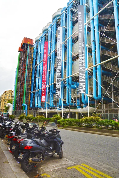 PARIS, FRANCE - AUGUST 18: Motorcycles and scooters parked near Center Georges Pompidou on August 18,2014 in Paris.Museum is third most visited attraction in Paris, about 5.5 million visitors per year