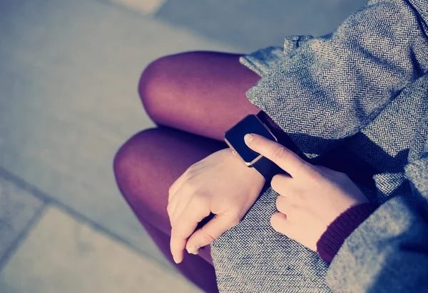 Female using modern smart watch