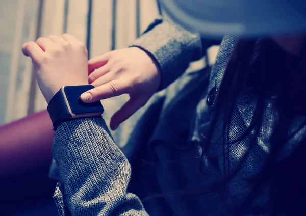 Woman using modern smart watch