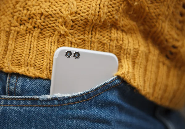 Dual lens camera phone in jeans pocket