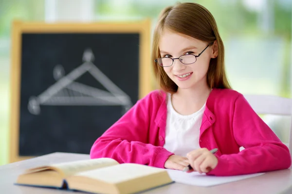 Smart little schoolgirl writing test