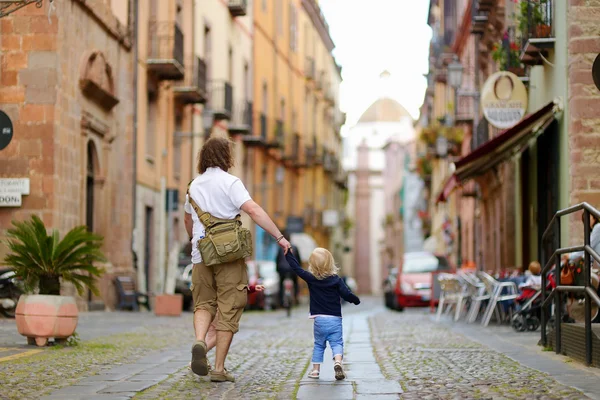 Father with daughter in an italian town