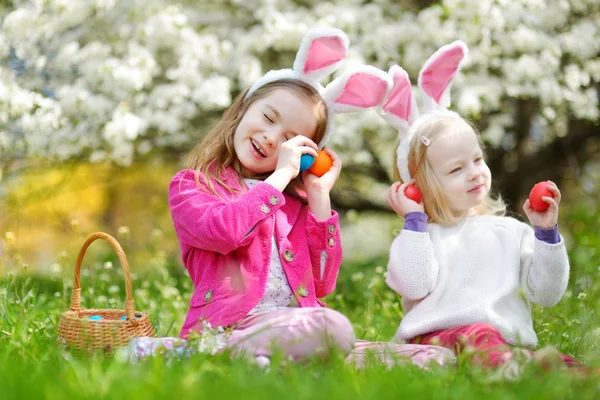 Sisters hunting for easter eggs