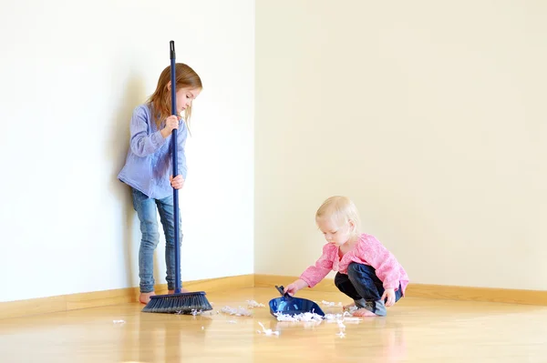 Girls helping her mom to clean up