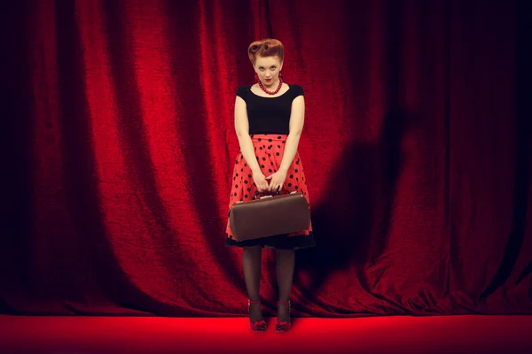 Woman in retro style with traveling bag