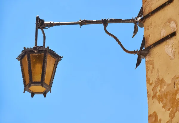 A street lamp on the house wall in Mdina. Malta