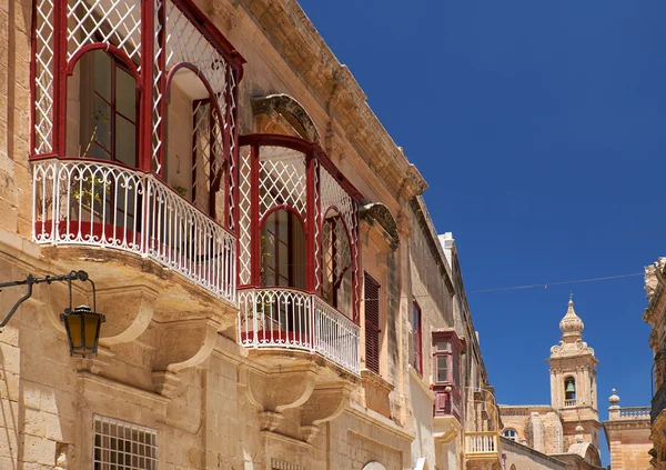 A side view of traditional Maltese style balconies in Mdina. Mal
