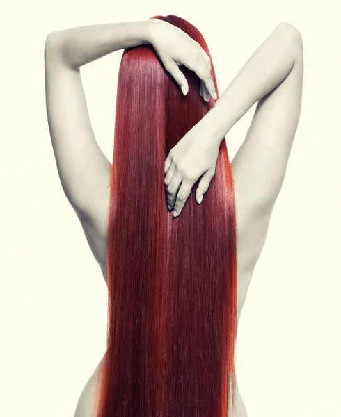 Nude woman with long red hair