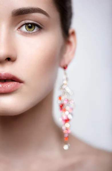 Half face close-up portrait of young woman