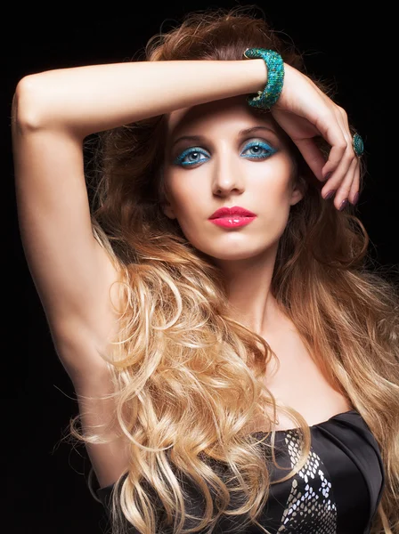 Portrait of young beautiful woman with curly shaggy hair style