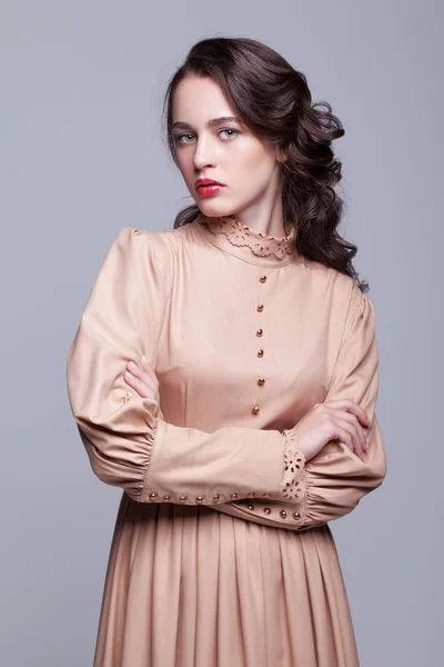 Portrait of young woman in retro dress