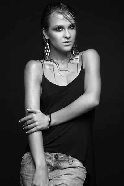 Woman with wet shining  makeup  on black background