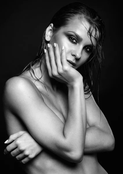 Woman with wet shining  makeup  on black background