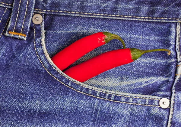 Red peppers in a jeans pocket