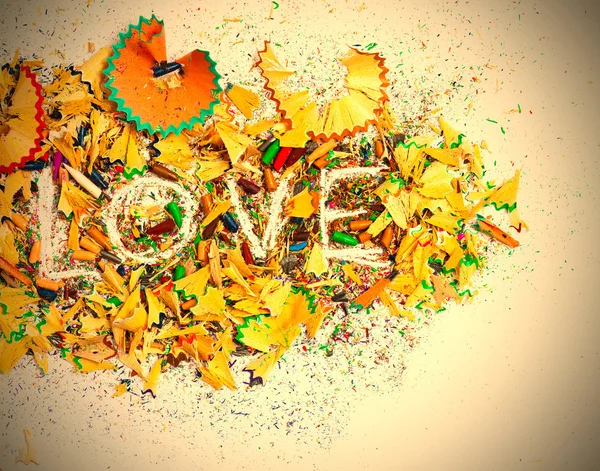 Word Love over a shavings of pencils