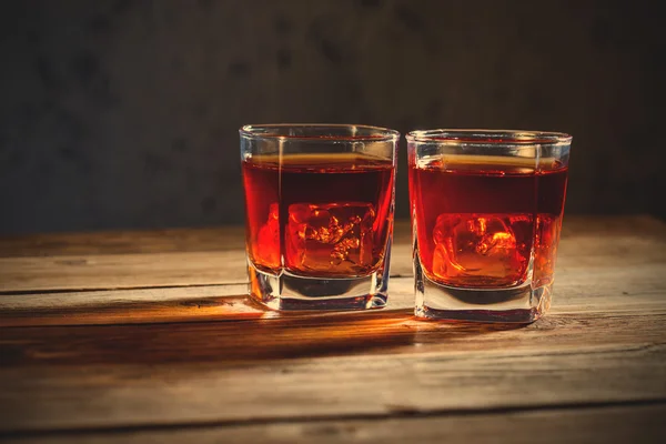 Two glasses of old whiskey