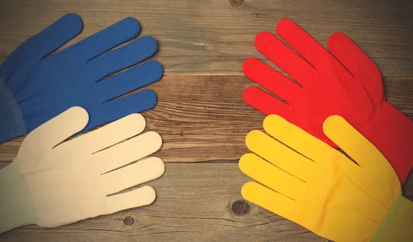 Four new working multicolored gloves