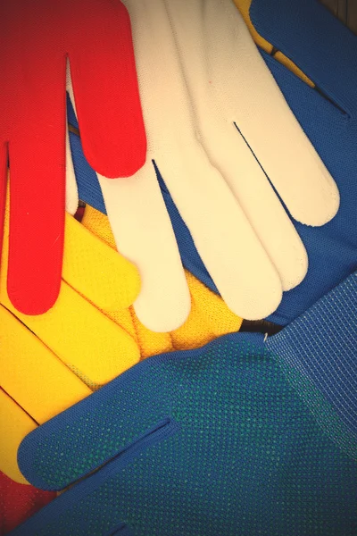 Colored work gloves on the display