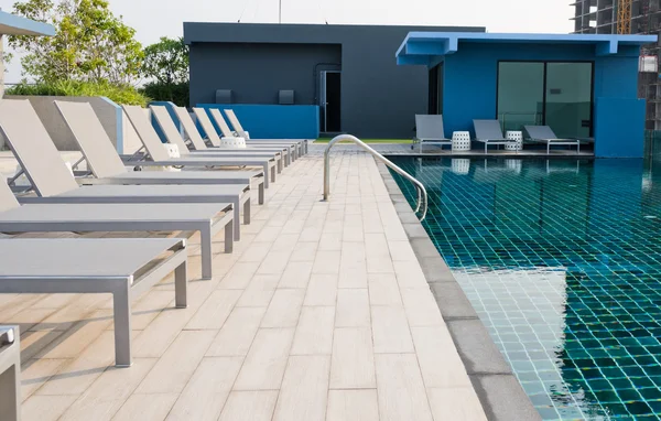 Swimming pool on roof deck building.