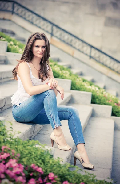 Woman sitting on steps