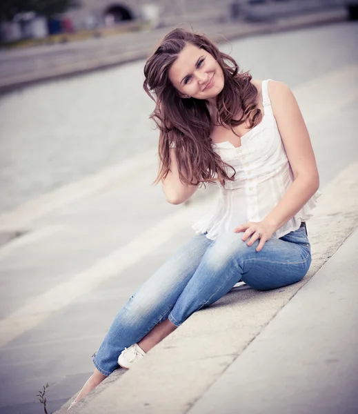 European woman smiling outdoors