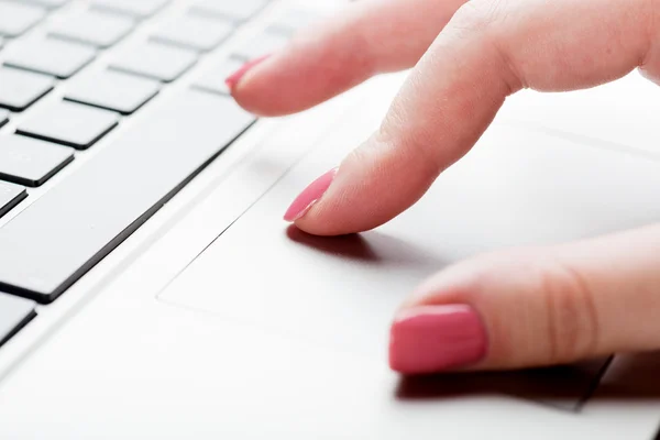 Female fingers typing on keyboard