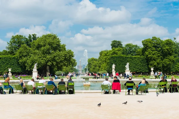 Tourists in famous Tuileries garden