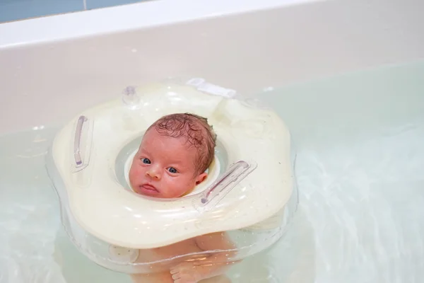 Baby swimming with neck swim ring