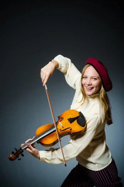 Woman violin player in musical concept