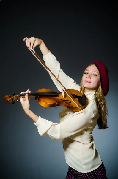 Woman violin player in musical concept