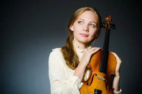 Woman violin player in musical concept