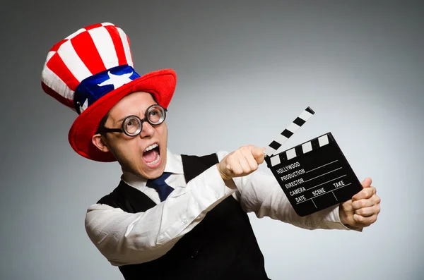 Man with american hat and movie board