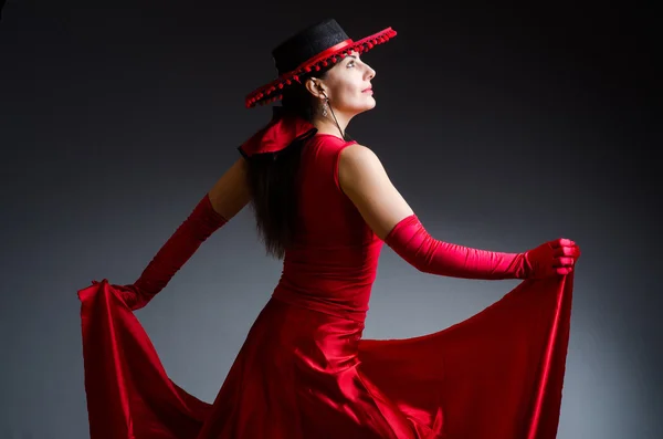 Woman dancing dances in red dress