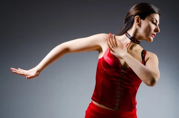 Woman dancing dances in red dress