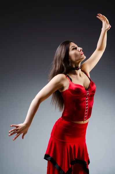 Woman dancing dances in red dress