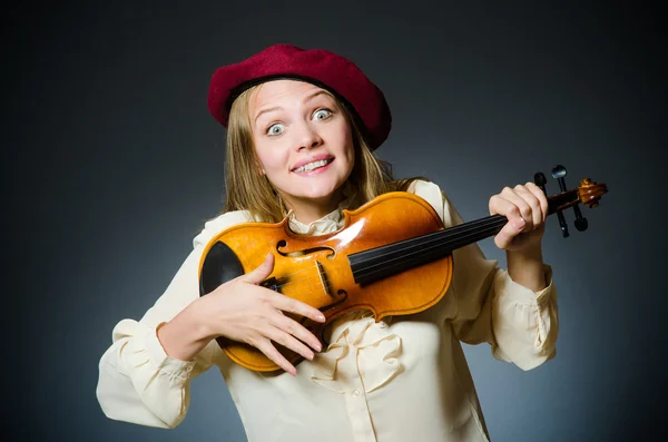 Woman violin player in musical concept