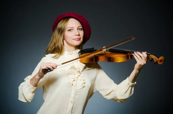 Woman violin player in musical concept