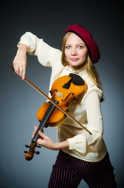 Woman violin player in musical concept