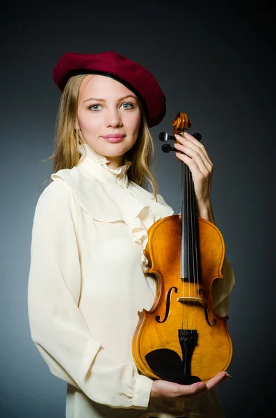 Woman violin player in musical concept