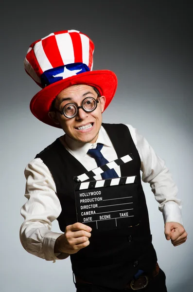 Man with american hat and movie board