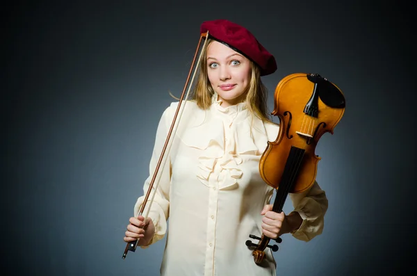 Woman violin player in musical concept