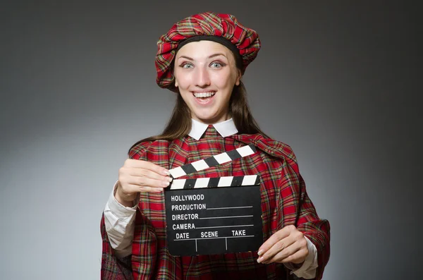 Woman in scottish clothing in movie concept