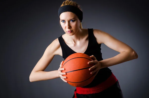 Woman with basketball in sport concept