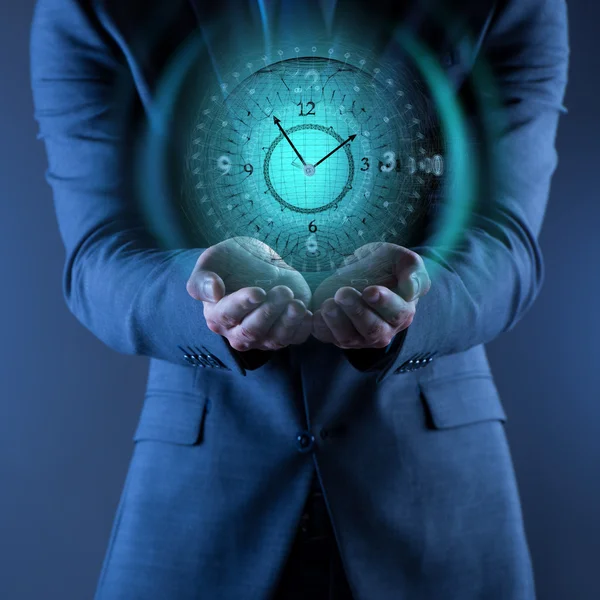 Businessman holding virtual clock in time is money concept