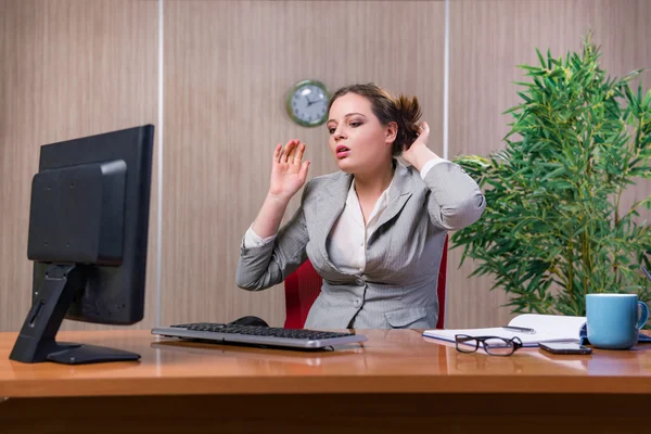 Businesswoman under stress working in the office