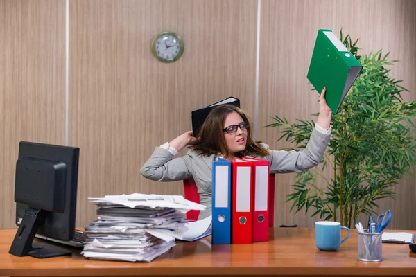 Businesswoman under stress working in the office